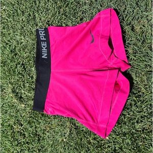 adult xs pink and black nike pros. never worn. good condition